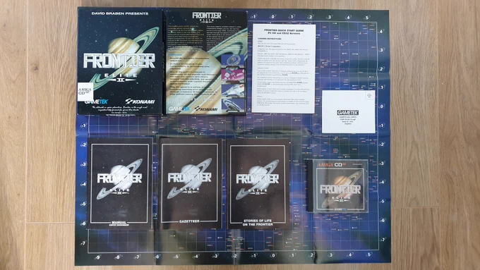 Frontier Elite 2 (Gametek/Konami, 1993) for the Commodore CD32 console - retail box contents, as follows:-
1. Game manual (105 pages)
2. Gazetteer (39 pages)
3. Stories Of Life On The Frontier (82 pages)
4. Game star map poster (73cm x 59cm)
5. Loading instructions
6. Software registration card