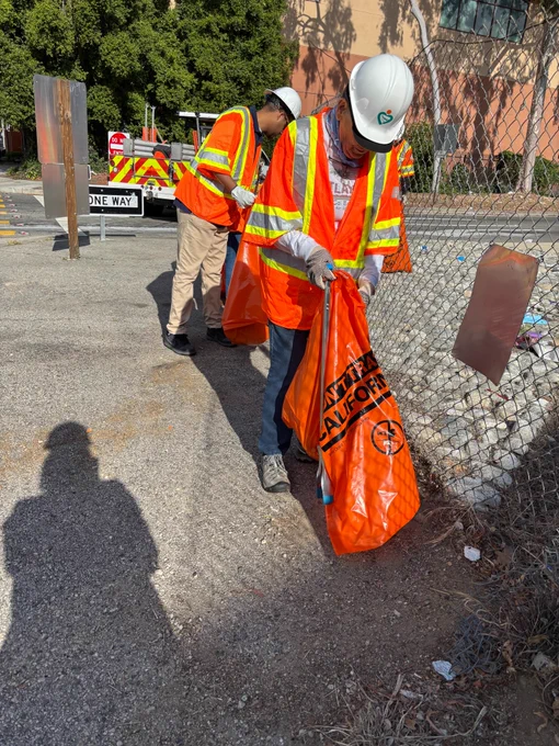 Picking up trash. 