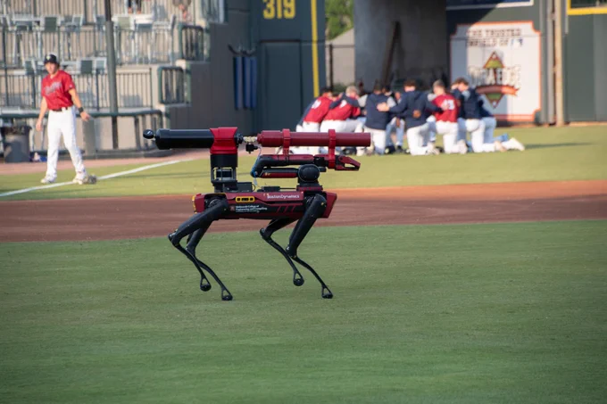 Spot robotic dog walking onto the field at Segra Park. 