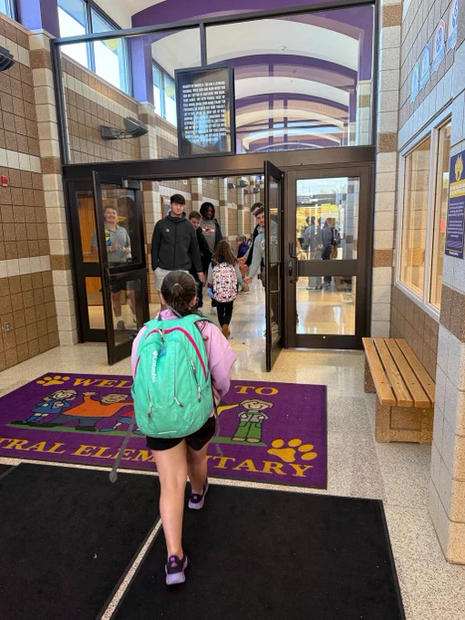 Students being greeted by ISU football team members