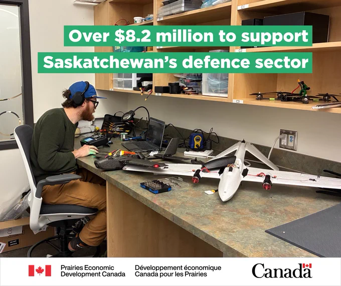 A Student Research Assistant at Sask Polytech is working at a desk with a large drone on it, with text: “Over $8.2 million to support Saskatchewan’s defence sector”. 