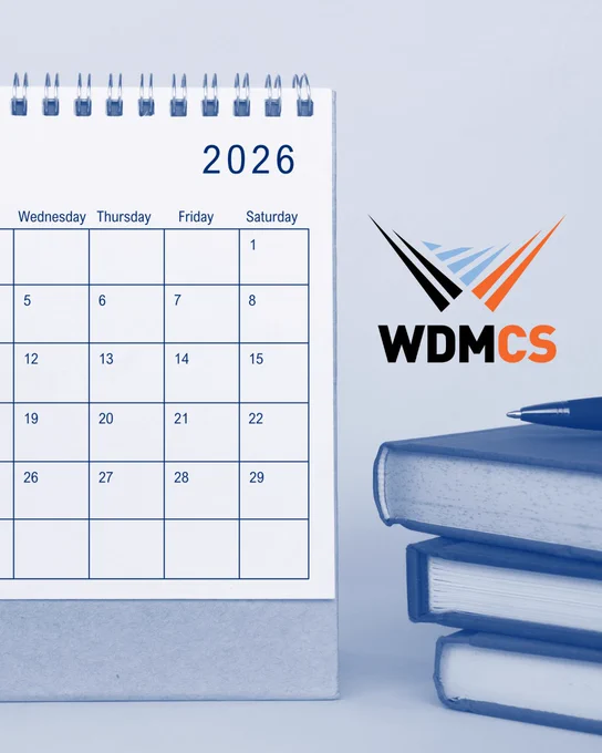 Blue-toned image of a calendar next to a stack of books with the WDMCS logo.