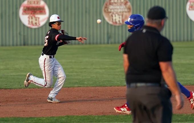 HHHS second baseman throws the ball