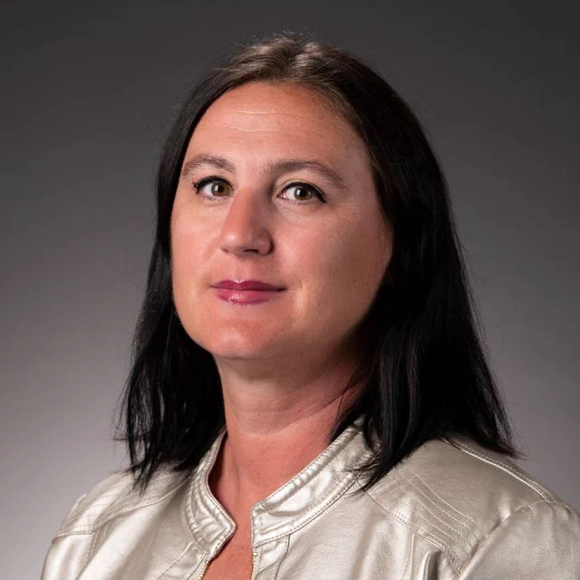 Headshot of UCSB Professor Karen Szumlinski, who is smiling and looking toward the camera.