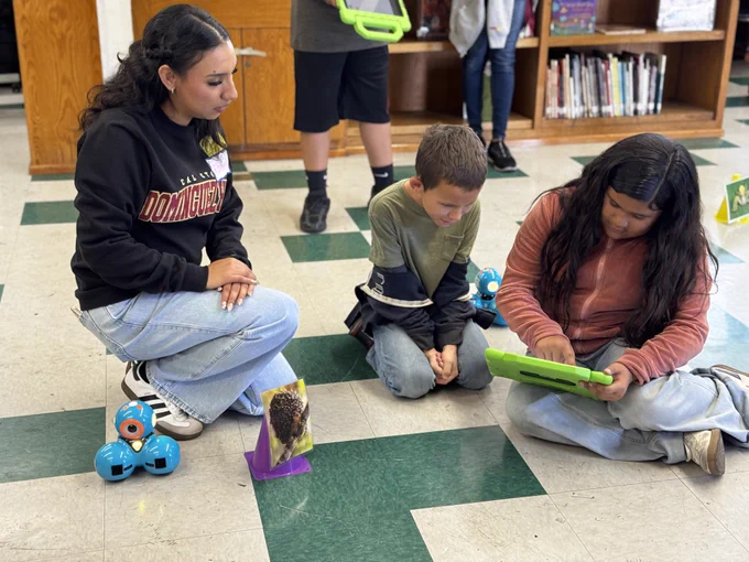 Students at 186th Street Elementary School engaging in robotics activities and guided by Liberal Studies students