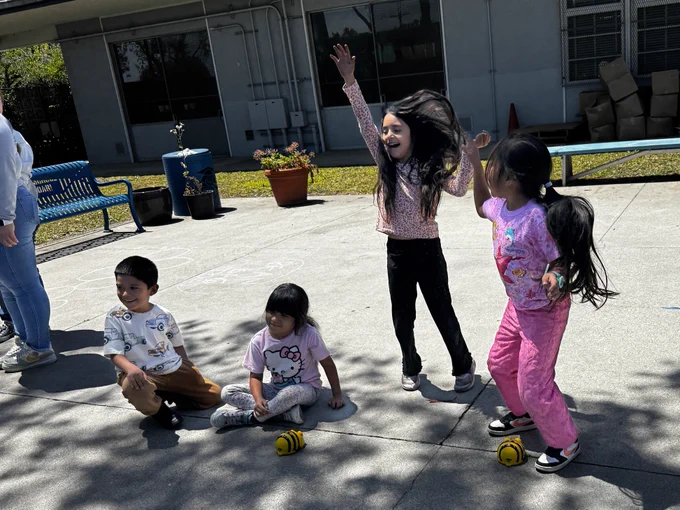 Students at 186th Street Elementary School engaging in robotics activities and guided by Liberal Studies students