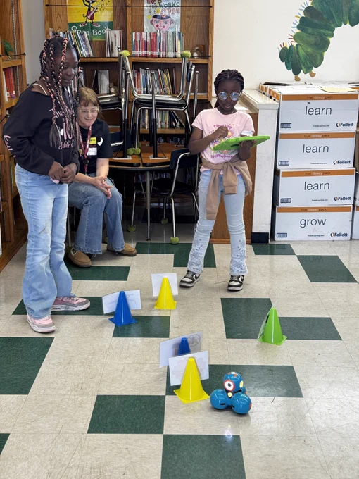 Students at 186th Street Elementary School engaging in robotics activities and guided by Liberal Studies students