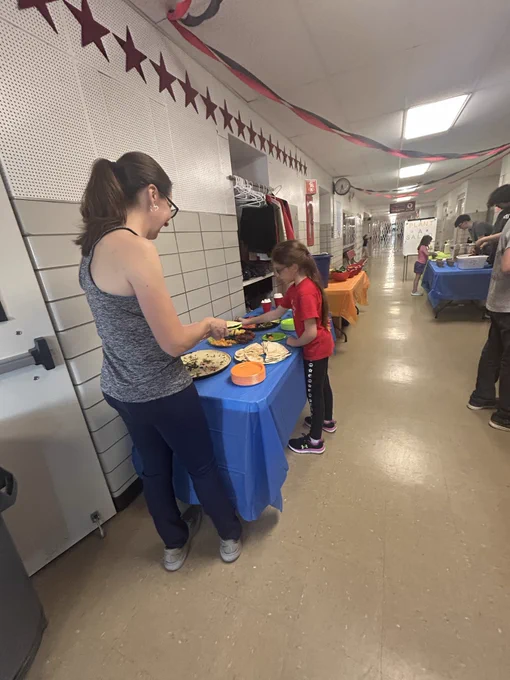 Adults and kids in the hallway
