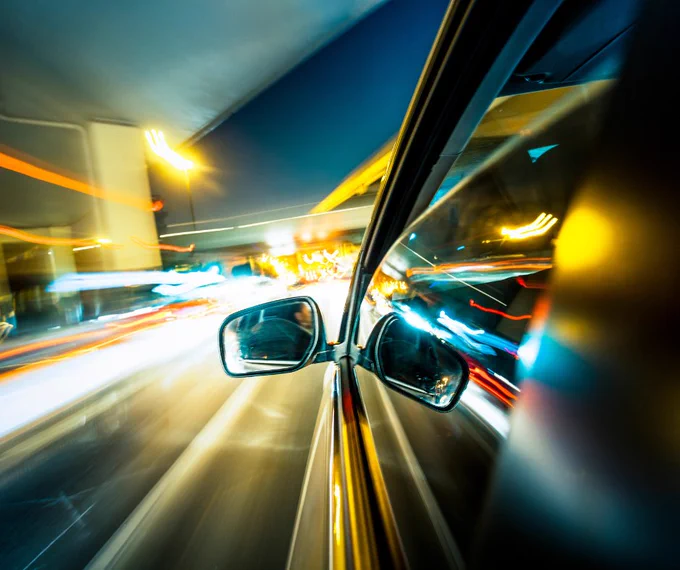 Car with passing streams of light
