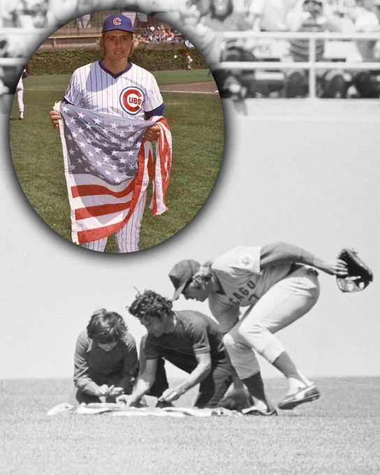 A black and white photo of Rick Monday taking the American flag away from two protestors who are attempting to burn it during a game. A circular cutout with color showing Rick Monday holding the American flag at Wrigley Field is also visible.