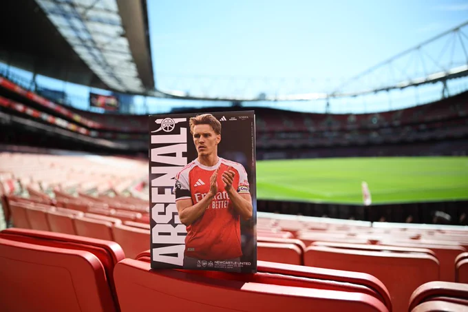 The matchday programme, featuring Martin Odegaard applauding the supporters at the Etihad last week on the cover, positioned on the seats at Emirates Stadium
