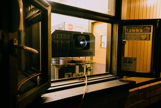 The projector beams light.