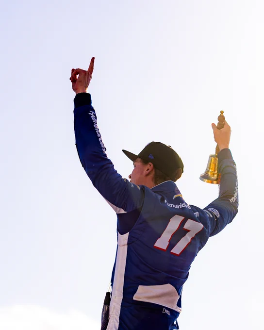 A photo of Corey Day celebrating his first career NASCAR O'Reilly Auto Parts Series victory. 