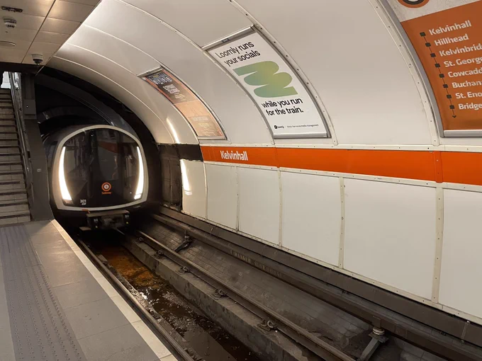 Glasgow subway train arriving at Kelvinhall station
