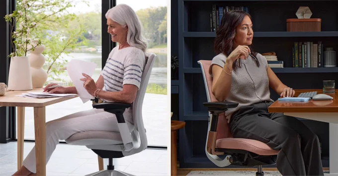 Senior woman in a striped sweater working on a laptop by a window with greenery outside, seated in a Steelcase Amia Office Chair.