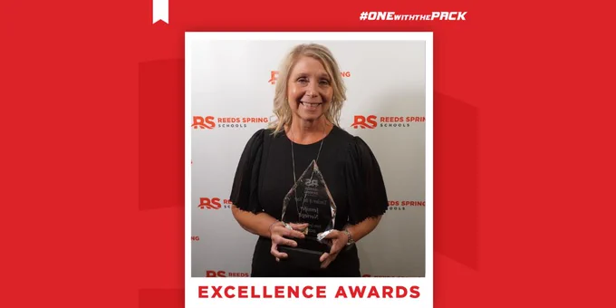 Jennifer Noriega holding a plaque
