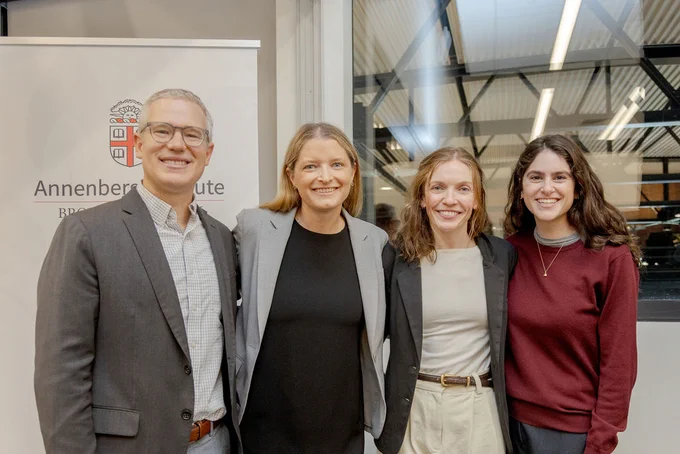 A group photo of Matthew Kraft, Laura Schifter, Grace Falken, and Samantha Kane at the SustainableED Conference
