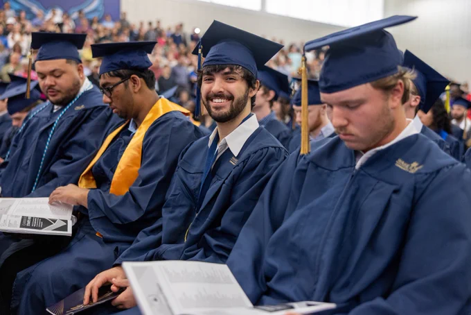 Graduate Christopher Velazquez is all smiles during the ceremony.
