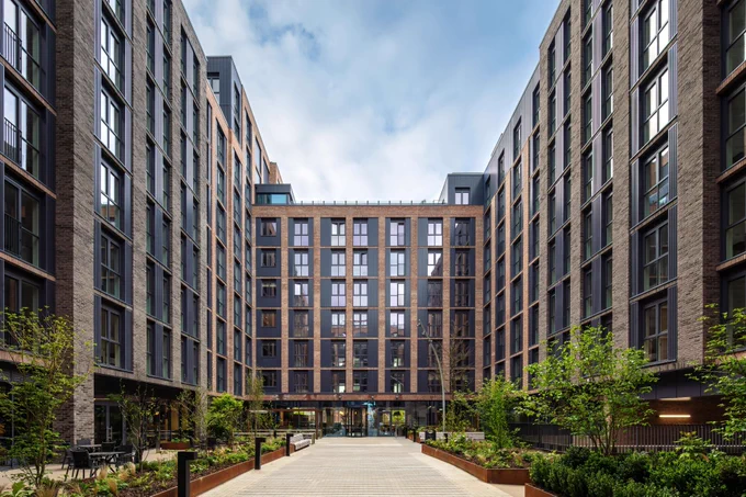 The image displays the Newmarket Yards apartment complex located in Dublin, Ireland.