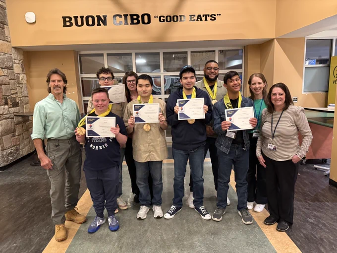 Group of home improvement students with instructors and staff members