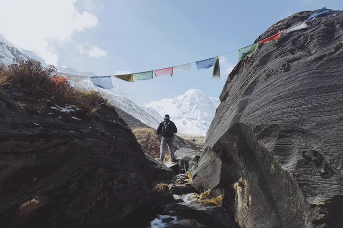 https://unsplash.com/photos/man-standing-on-rock-facing-glacier-mountains-at-the-distance-X0KxbDjp9I0