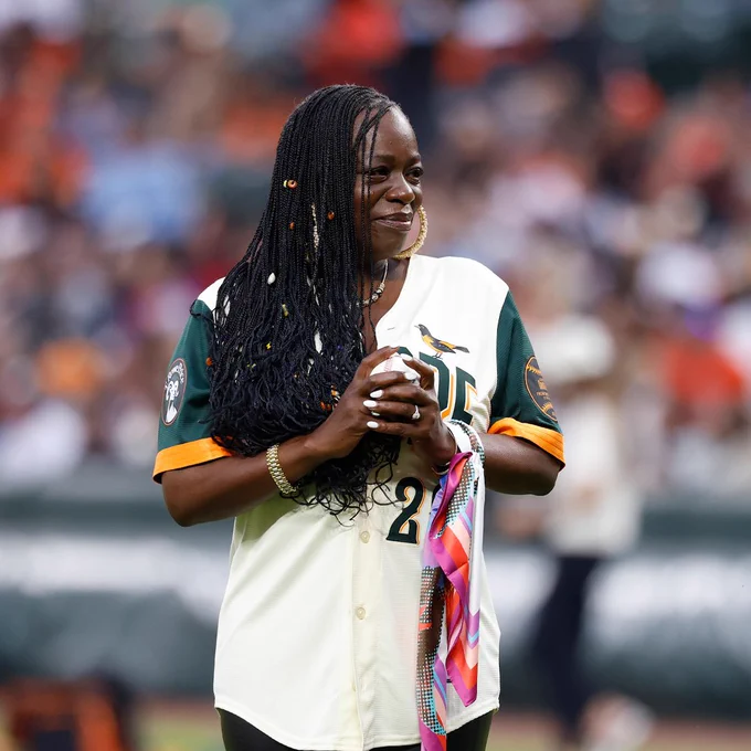 Sekyiwa 'Set' Shakur prepares to throw out the ceremonial first pitch in an Orioles City Connect uniform.
