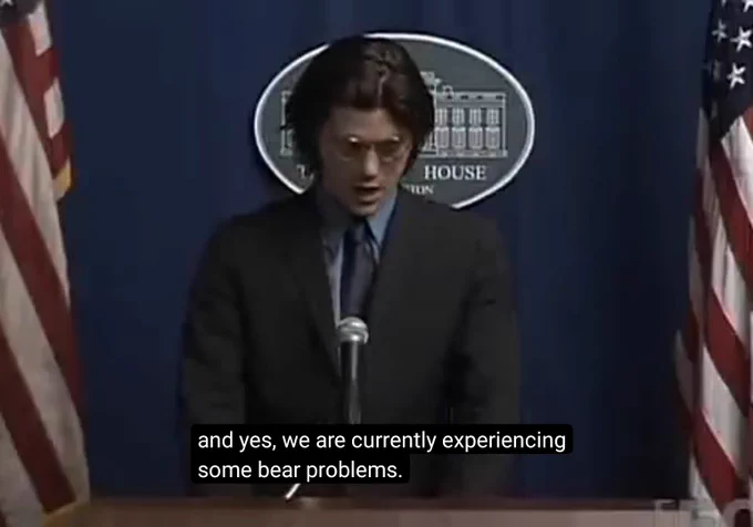 Screenshot from a whitest kids you know episode with Trevor standing infront of a white house press briefing saying "and yes, we are currently experiencing some bear problems."