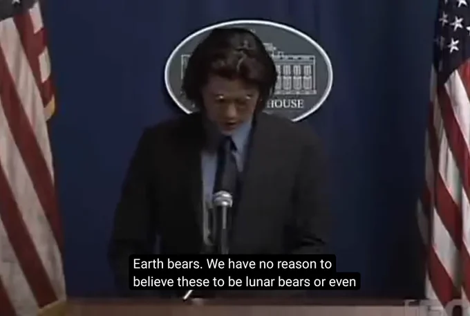 Screenshot from a whitest kids you know episode with Trevor standing infront of a white house press briefing saying "Earth bears. We have no reason to believe these to be lunar bears or even"