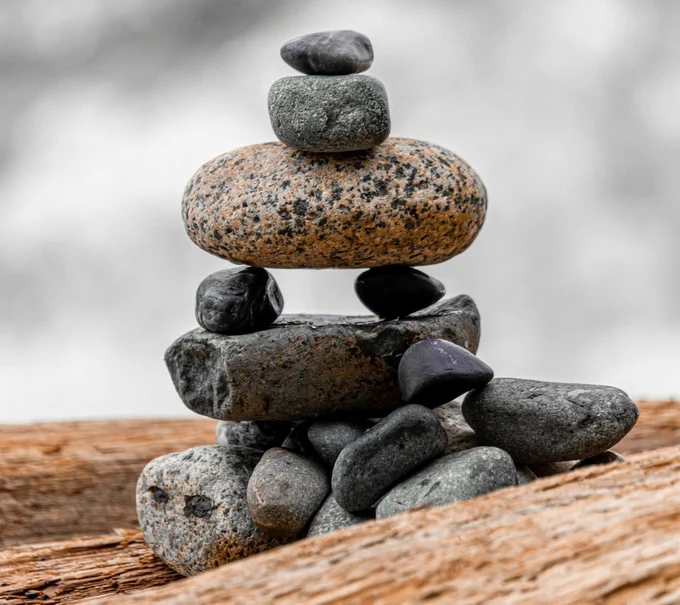 A stack of balanced rocks from Darien Attridge at Unsplash. The image has been cropped and resized.