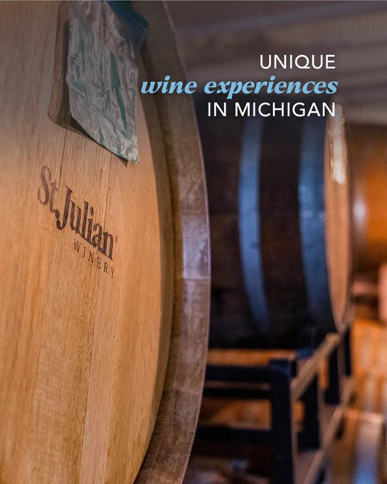 Large wine barrels inside a cellar at St. Julian Winery with overlay text reading: Unique wine experiences in Michigan