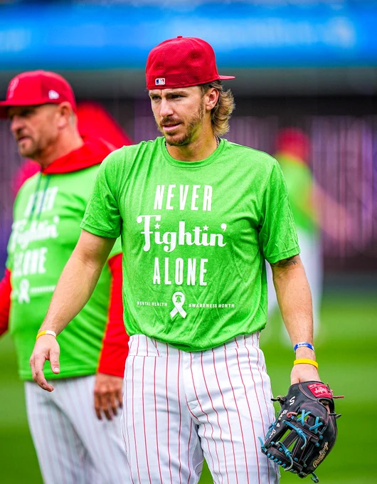 The Phillies are pictured at BP wearing green shirts for Mental Health Awareness