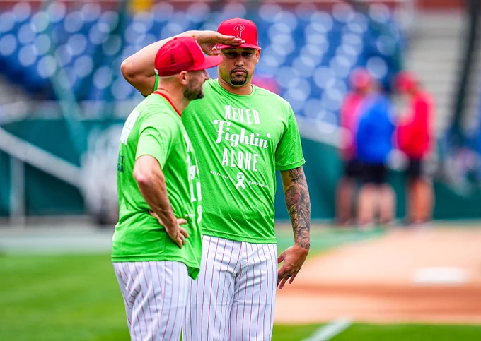 The Phillies are pictured at BP wearing green shirts for Mental Health Awareness