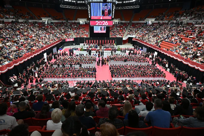 Color indoor photo of Beasley Coliseum full of students and family during Spring Commencement 2026