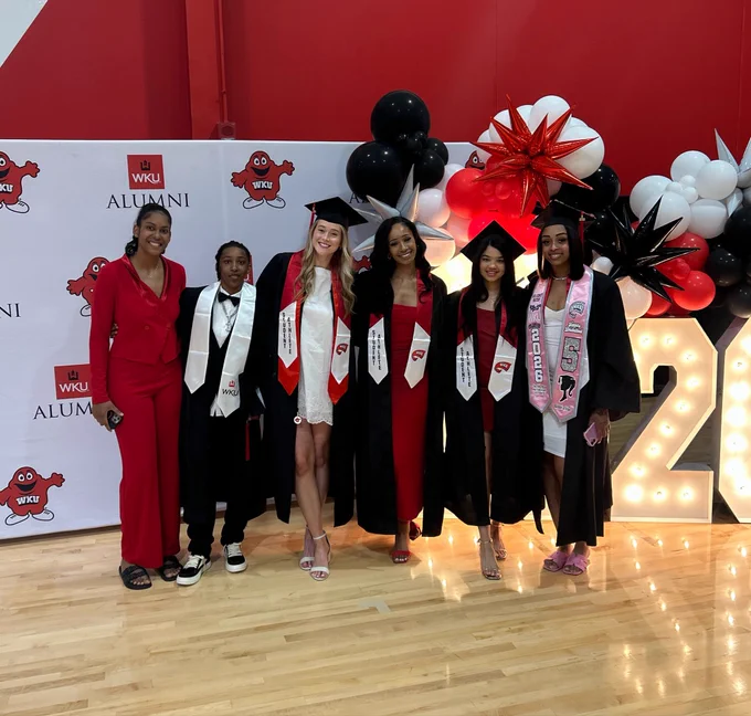Jeniffer Silva, Tia Shelling, Tatum Boettjer, Caleigh-Rose West, Yendri Acosta, Mya Pratcher pose in cap and gown at WKU graduation
