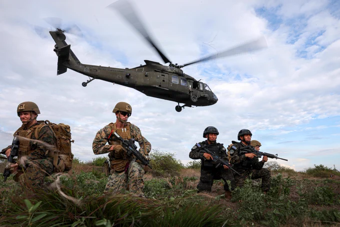 U.S. Marines with 4th Reconnaissance Battalion and Salvadoran marines with the 1st Marine Brigade of El Salvador provide security as a UH-60 Black Hawk helicopter takes off during personnel recovery training at CENTAM Guardian 2026 in La Union, El Salvador, April 22, 2026. CG 26, an annual, multinational exercise, brings together military and security personnel from El Salvador, Honduras, Guatemala, Costa Rica, Belize, the Dominican Republic, and the United States, ensuring seamless interoperability in times of crisis and contingency response while also demonstrating a united front against shared regional security challenges. (U.S. Marine Corps photo by Sgt. Samuel Qin)\n\n