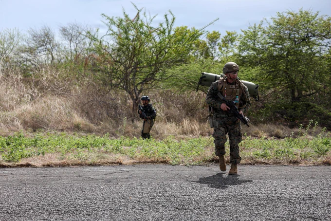 A U.S. Marine with 4th Reconnaissance Battalion and a Salvadoran marine with the 1st Marine Brigade of El Salvador search for a simulated downed aircraft crew during personnel recovery training at CENTAM Guardian 2026 in La Union, El Salvador, April 22, 2026. CG 26, an annual, multinational exercise, brings together military and security personnel from El Salvador, Honduras, Guatemala, Costa Rica, Belize, the Dominican Republic, and the United States, ensuring seamless interoperability in times of crisis and contingency response while also demonstrating a united front against shared regional security challenges. (U.S. Marine Corps photo by Sgt. Samuel Qin)