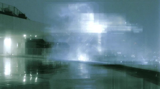 Diffuse urban lights dissolving into fog and wet reflections after rainfall, forming an unstable atmospheric surface
