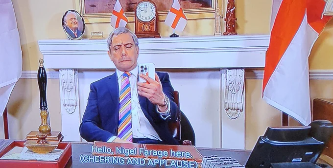 A still image of a comedian/ actor on snl uk pretending to be Nigel Farage.