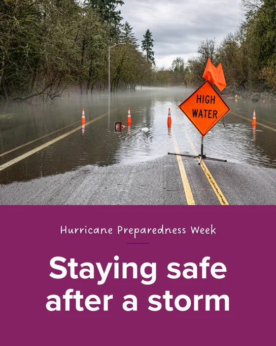Flooded road with traffic cones and a "High Water" warning sign. Surrounding trees and cloudy sky are visible. Text on a purple banner reads: "Hurricane Preparedness Week - Staying safe after a storm.