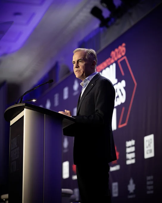 Prime Minister Carney talks at a podium in Toronto, Ontario.