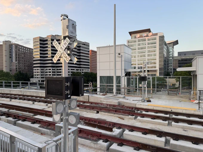 Tracks with miniature railroad crossing signs, Silver Spring Purple Line station.