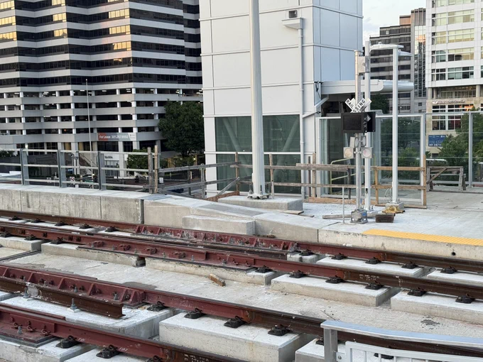 Tracks with miniature railroad crossing signs, Silver Spring Purple Line station.