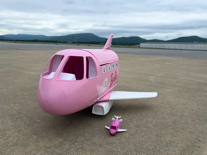 Large Barbie plane next to mini Barbie plane on ROA apron