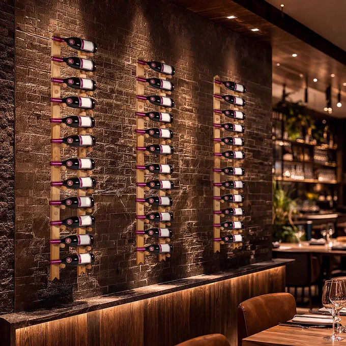 Wine bottles on a wall in a restaurant.