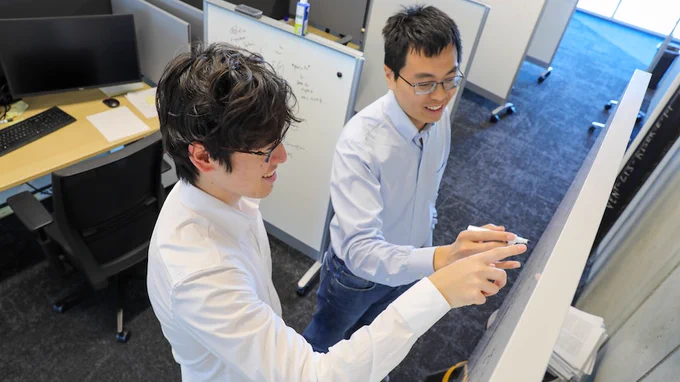 Photo of School of CSE Ph.D. student Phillip Si (left) and Assistant Professor Peng Chen (right). The pair developed LD-EnSF, an AI framework that turns massive, slow computational problems into much faster solutions, making advanced science more efficient and potentially more useful during time-critical events.