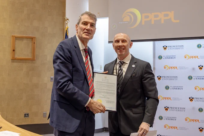PPPL Director Steve Cowley holds a proclamation with Michael Blatt of the NJ Department of Labor and Workforce Development. 