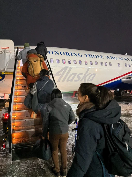 Mary Peltola, others, boarding an Alaska Airlines aircraft