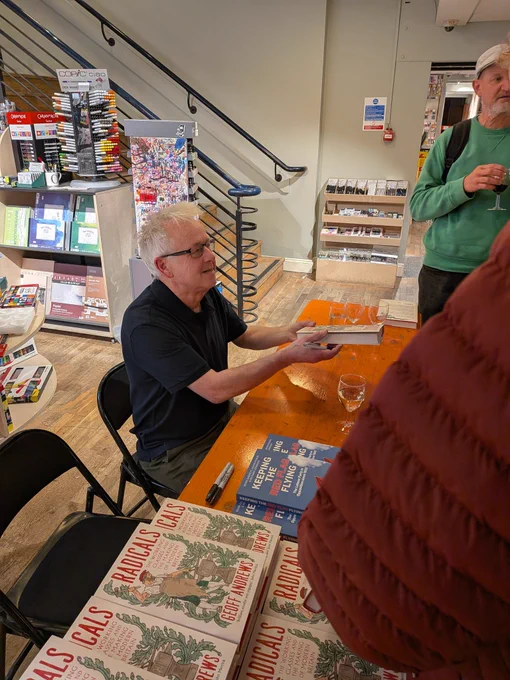 Author Geoff Andrews signing copies of Radicals