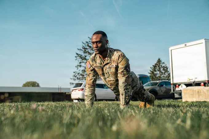 A Soldier with the Old Guard performs a push up. 