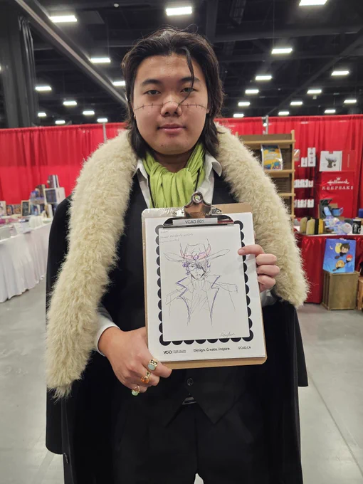 Photo from VCAD’s booth at Calgary Fan Expo showing attendees, cosplayers, and artists engaging in creative activities, character sketch experiences, and interactive design challenges while exploring art, imagination, and community at the event.